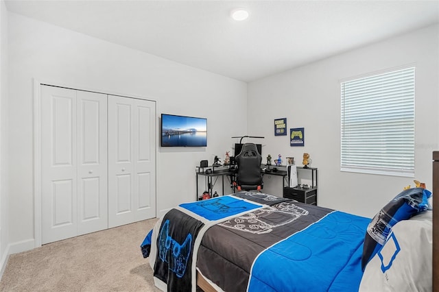 carpeted bedroom with a closet