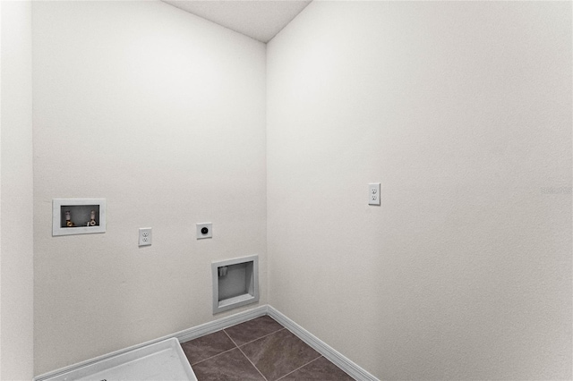 laundry room featuring laundry area, dark tile patterned floors, washer hookup, baseboards, and electric dryer hookup