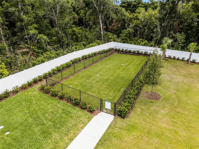 exterior space featuring a fenced backyard and a yard