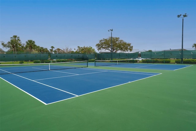 view of sport court with fence