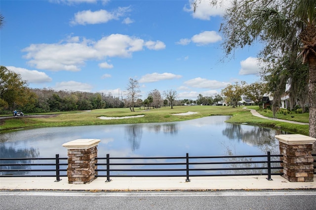 view of water feature with fence