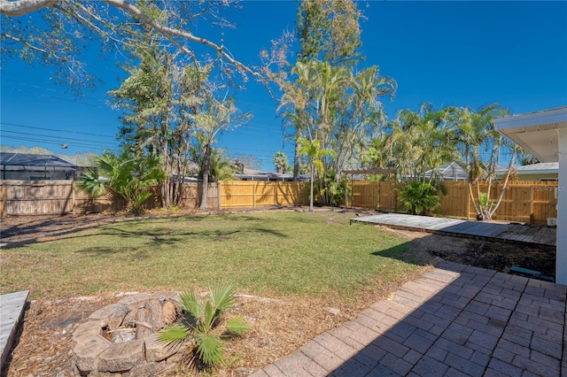 view of yard featuring a patio area and a fenced backyard