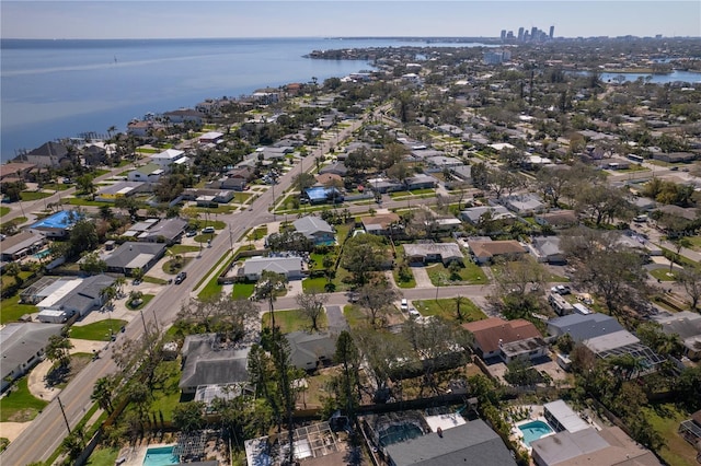 birds eye view of property featuring a water view and a residential view