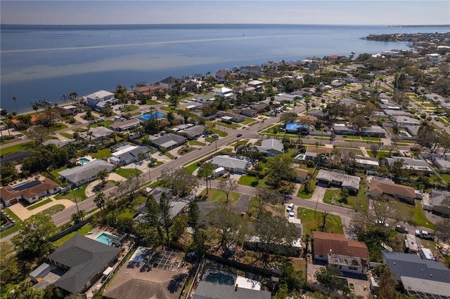 birds eye view of property featuring a water view and a residential view