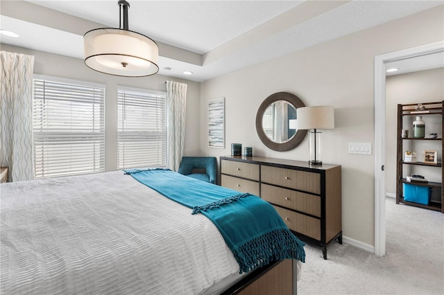 bedroom featuring baseboards, recessed lighting, and light colored carpet