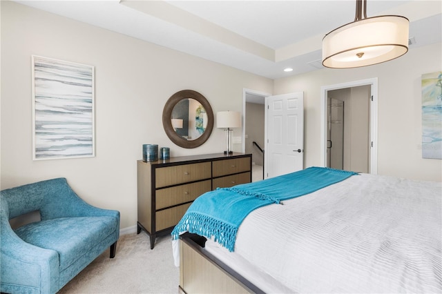 bedroom featuring recessed lighting, a raised ceiling, light colored carpet, and baseboards