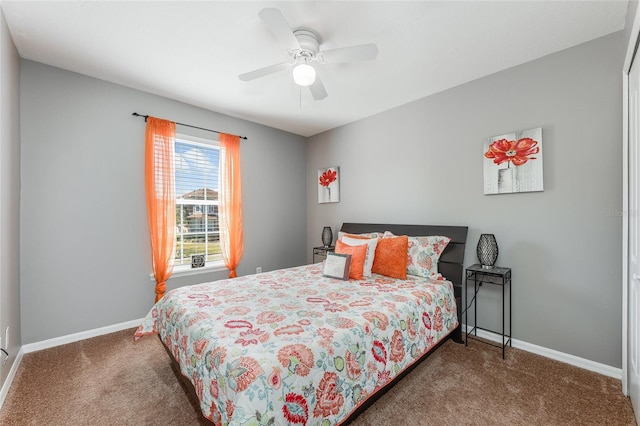 bedroom with ceiling fan, carpet flooring, and baseboards