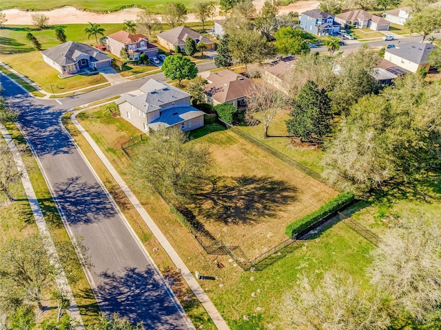 birds eye view of property with a residential view