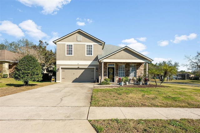 traditional-style house with stucco siding, a garage, stone siding, driveway, and a front lawn