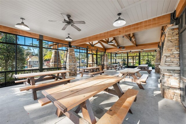 interior space with ceiling fan