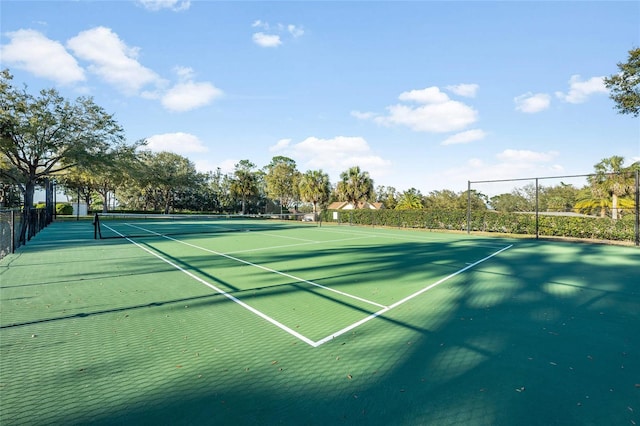 view of sport court with fence