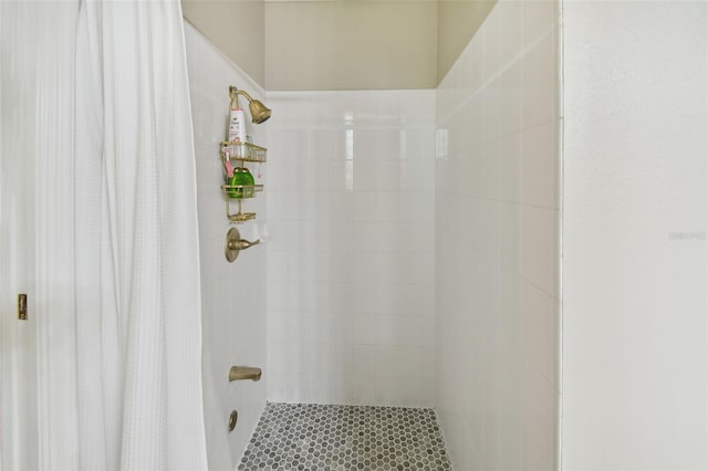 bathroom with a tile shower