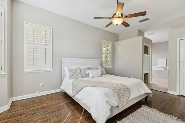 bedroom featuring ceiling fan, wood finished floors, visible vents, and baseboards