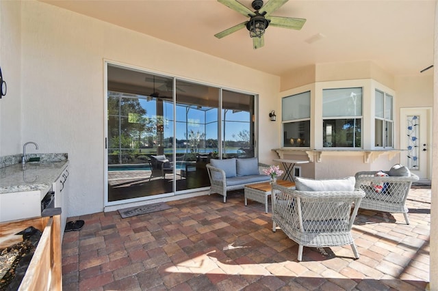 view of patio / terrace featuring an outdoor hangout area and a ceiling fan