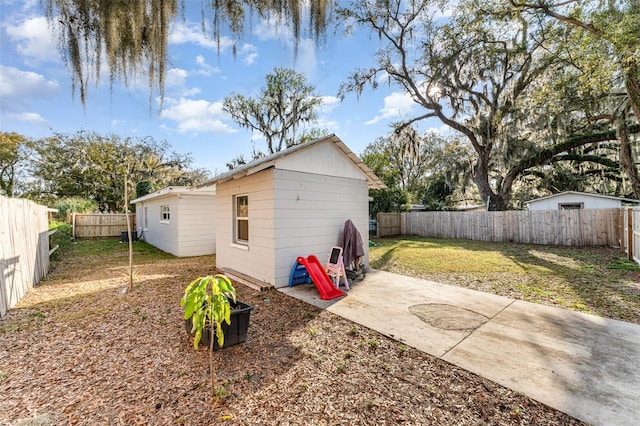 view of outbuilding featuring an outbuilding and a fenced backyard