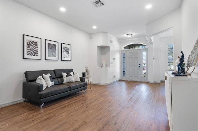 entryway with baseboards, light wood-style flooring, visible vents, and recessed lighting