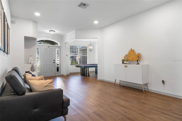 foyer featuring recessed lighting, visible vents, baseboards, and wood finished floors