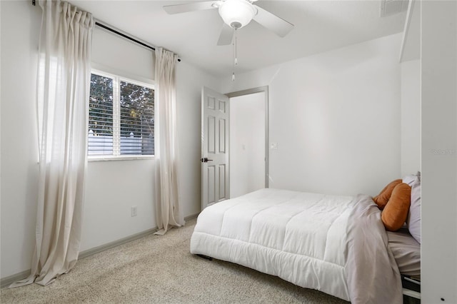 bedroom featuring carpet, baseboards, and ceiling fan