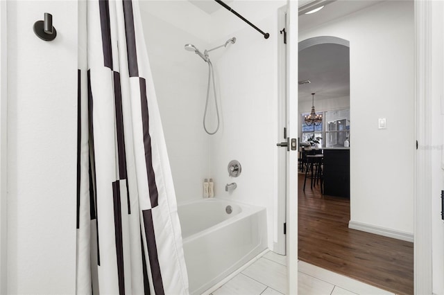 bathroom with tile patterned flooring and shower / bath combo