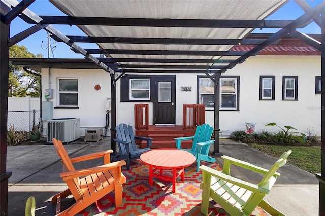 view of patio / terrace with central air condition unit, fence, and a pergola