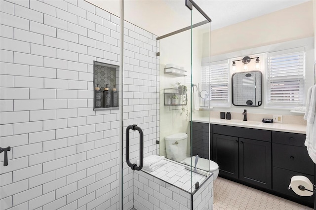 full bath featuring a stall shower, tile patterned flooring, and vanity