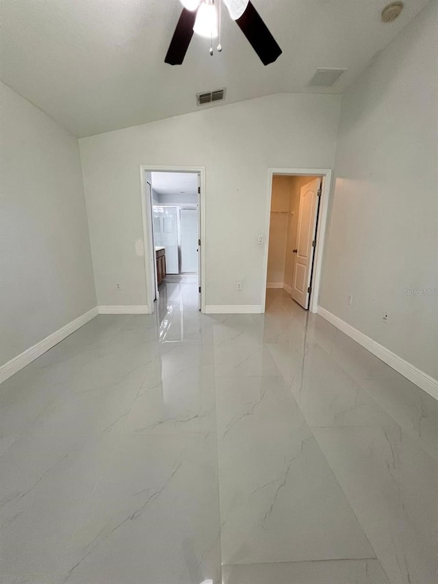 unfurnished room featuring marble finish floor, a ceiling fan, visible vents, and baseboards