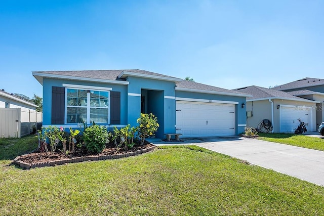 view of front of property featuring a garage, fence, concrete driveway, stucco siding, and a front lawn