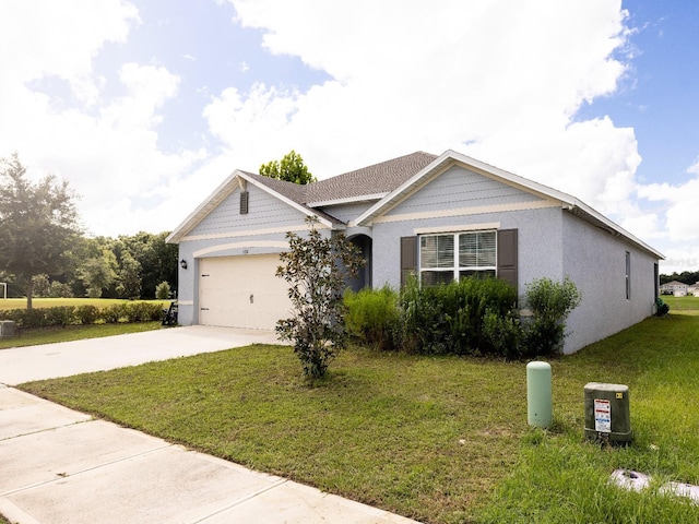 ranch-style house with a garage, driveway, a front yard, and stucco siding