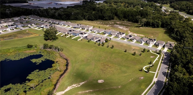 drone / aerial view with a water view and a residential view