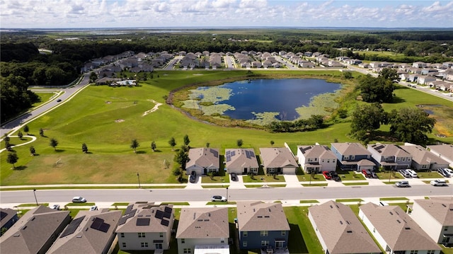 birds eye view of property with a water view and a residential view