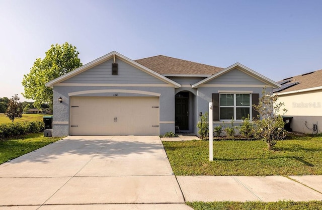 3332 Logan Berry Dr, Mount Dora, FL 32757 - view of front facade with a front lawn, a garage, concrete driveway, and stucco siding