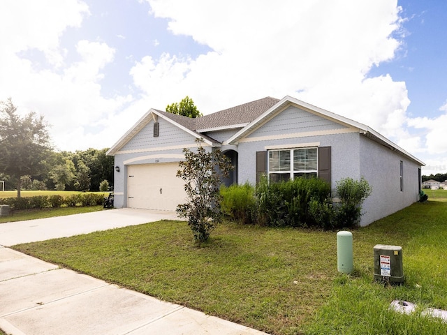 3332 Logan Berry Dr, Mount Dora, FL 32757 - ranch-style home featuring driveway, an attached garage, a front lawn, and stucco siding