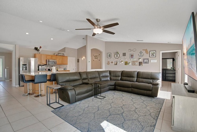 living room featuring light tile patterned floors, lofted ceiling, recessed lighting, ceiling fan, and a textured ceiling