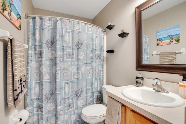 bathroom featuring a shower with shower curtain, vanity, and toilet