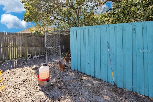 view of yard with an outbuilding and a fenced backyard