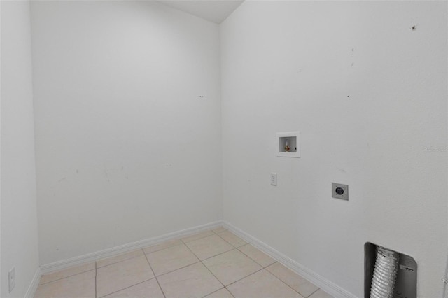 washroom featuring washer hookup, hookup for an electric dryer, light tile patterned flooring, laundry area, and baseboards