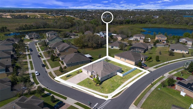 aerial view with a water view and a residential view