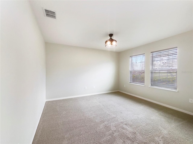 15120 Zenith Ave, Mascotte, FL 34753 - unfurnished room featuring carpet floors, visible vents, and baseboards