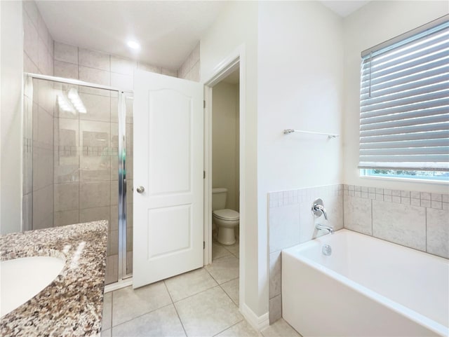 15120 Zenith Ave, Mascotte, FL 34753 - bathroom with a stall shower, tile patterned flooring, a garden tub, and toilet