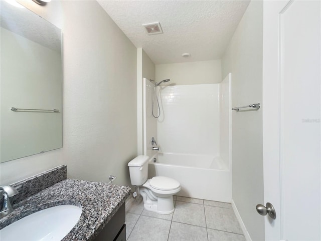 15120 Zenith Ave, Mascotte, FL 34753 - full bath featuring visible vents, toilet, tile patterned flooring, a textured ceiling, and vanity