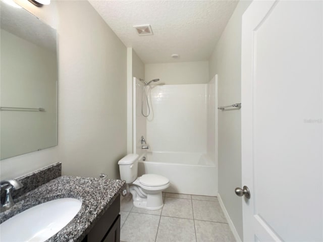 15120 Zenith Ave, Mascotte, FL 34753 - bathroom featuring bathtub / shower combination, toilet, a textured ceiling, vanity, and tile patterned floors