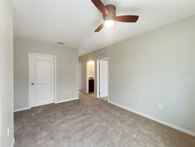 15120 Zenith Ave, Mascotte, FL 34753 - empty room with carpet flooring, visible vents, and baseboards