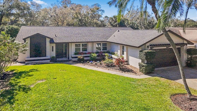 ranch-style home featuring driveway, a front lawn, and stucco siding