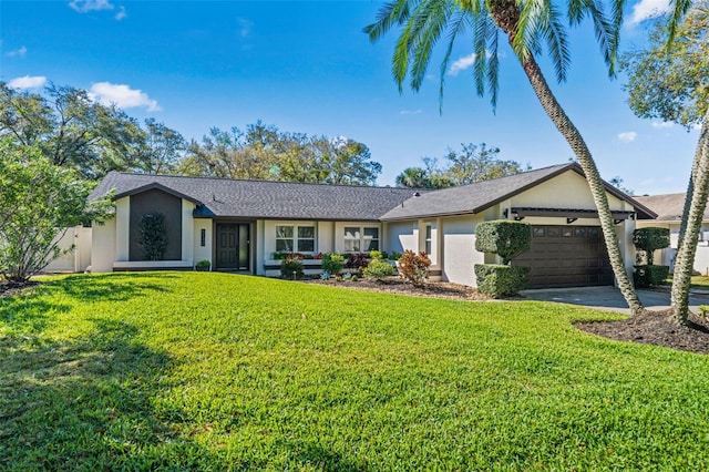 single story home with a garage, a front yard, concrete driveway, and stucco siding