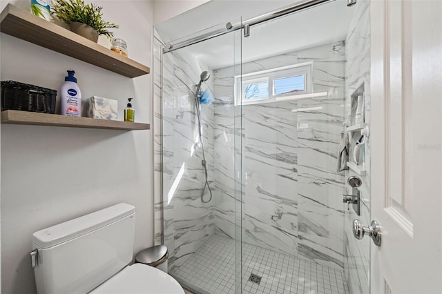 full bath featuring a marble finish shower and toilet