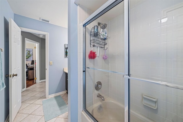 full bath featuring visible vents, baseboards, enclosed tub / shower combo, tile patterned flooring, and vanity