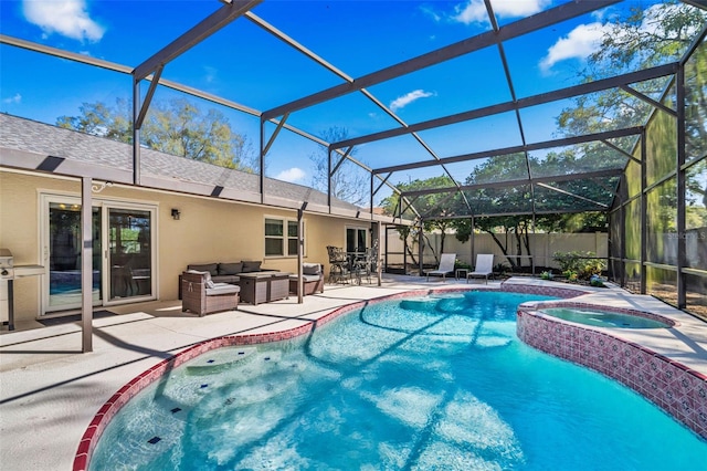 view of pool featuring a lanai, fence, a patio area, a pool with connected hot tub, and an outdoor living space