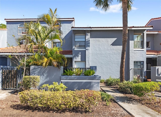 exterior space with fence and stucco siding