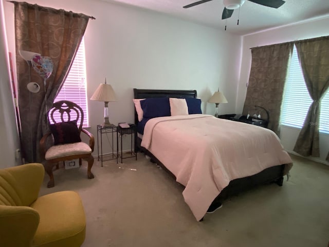 carpeted bedroom featuring a ceiling fan