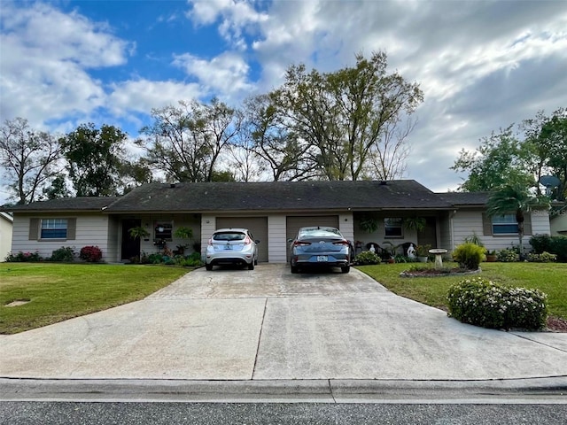 ranch-style house featuring a garage, concrete driveway, and a front yard